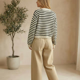 Navy chunky knit striped cardigan by Miou Muse, featuring a cozy, textured sweater with bold horizontal stripes.