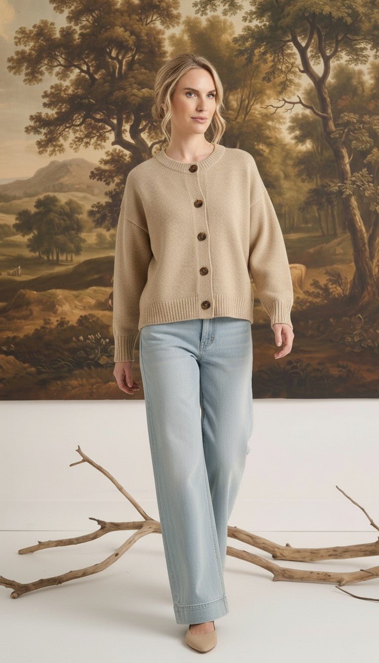 graced mushroom crew neck cardigan with button front, worn by a model with light blue jeans in a studio setting