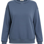 graced indigo crewneck pullover top with a classic neckline and ribbed hem detail for a polished casual look