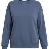 graced indigo crewneck pullover top with a classic neckline and ribbed hem detail for a polished casual look
