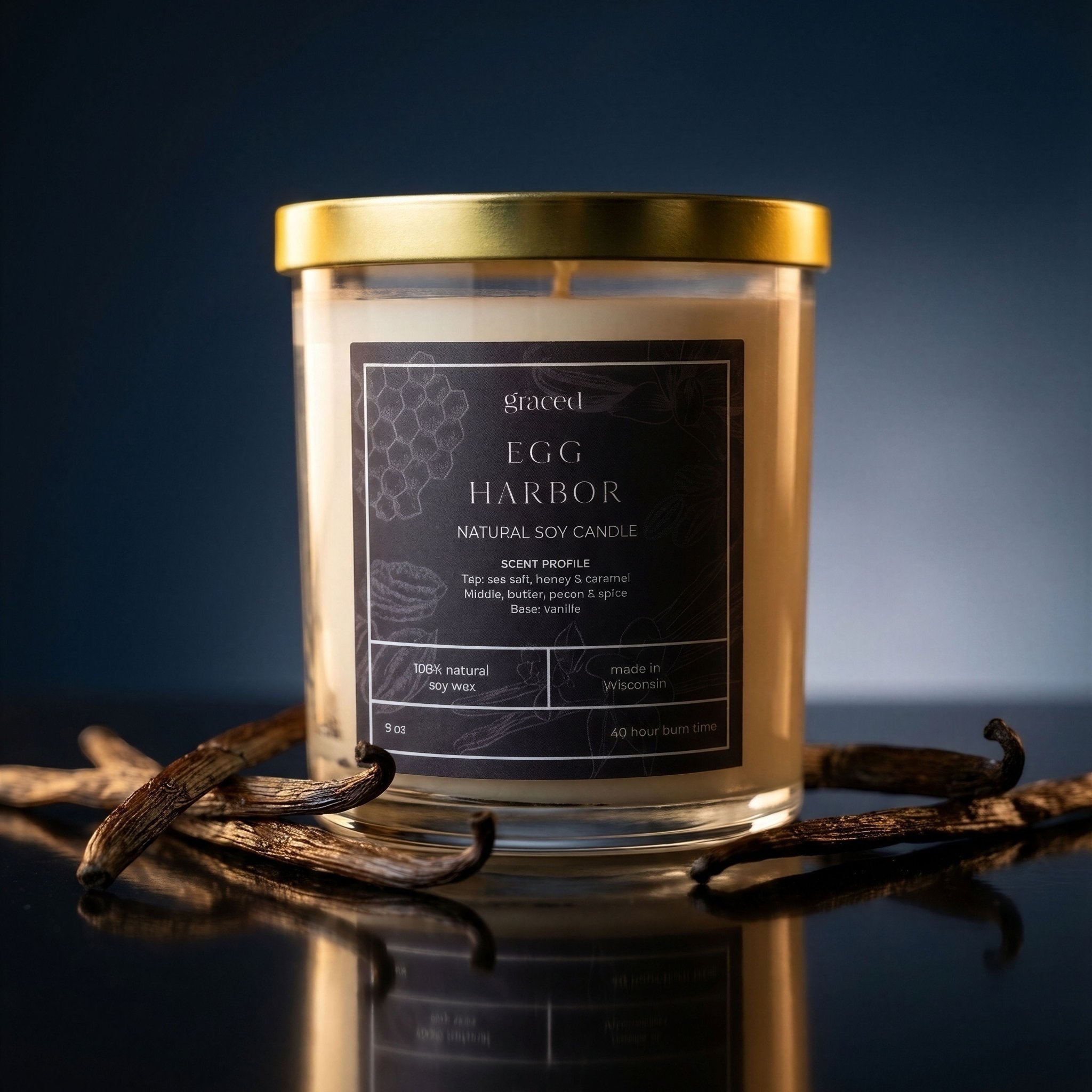 Egg Harbor natural soy wax candle by graced, showcasing a simple white candle with a wooden wick in a glass jar.