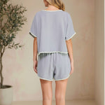 Allie Rose embroidered linen tie shorts with intricate embroidery, lightweight breathable fabric, and a relaxed fit.