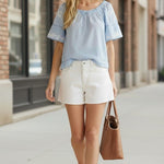 Blue embroidered raglan short sleeve top by Lovestitch, featuring floral embroidery on a casual blouse.