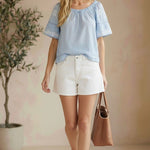 Blue embroidered raglan short sleeve blouse by Lovestitch, featuring floral embroidery and relaxed fit.