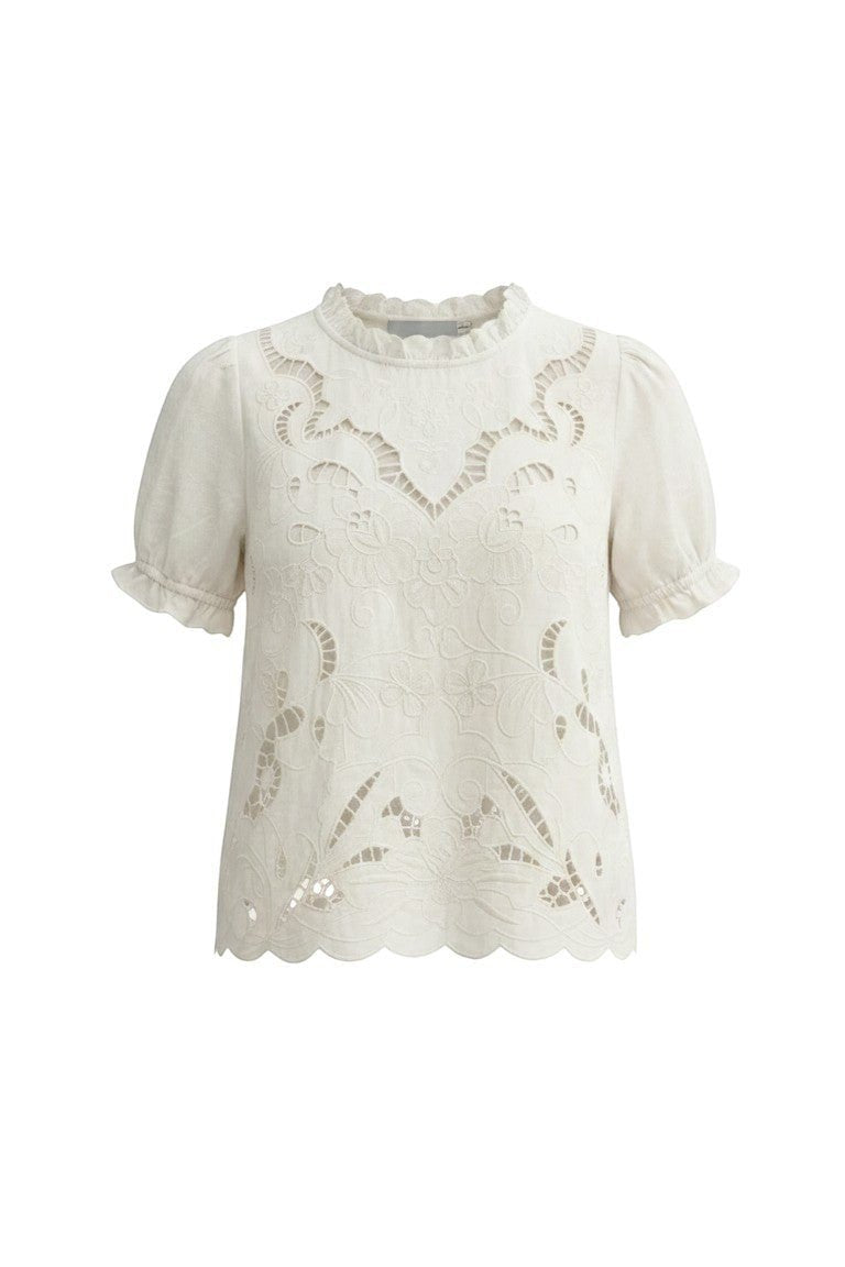 Off-white embroidered short sleeve blouse by Camellia featuring delicate floral embroidery and a relaxed fit.