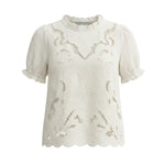 Off-white embroidered short sleeve blouse by Camellia featuring delicate floral embroidery and a relaxed fit.