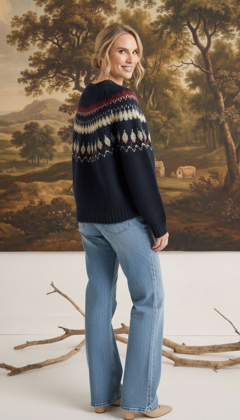 graced Fair Isle crew neck sweater in navy with geometric pattern worn by a woman with light blue jeans