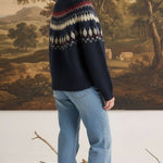 graced Fair Isle crew neck sweater in navy with geometric pattern worn by a woman with light blue jeans