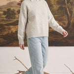 graced floral embroidered pullover sweater in beige worn over a white collared shirt with light wash jeans