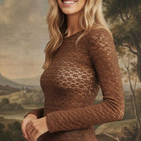 graced mocha floral lace knit top with long sleeves worn by a smiling blonde model against a painted landscape backdrop