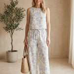 Light blue floral linen pants by Allie Rose, featuring a relaxed fit and small blossom pattern, perfect for casual wear.