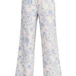 Allie Rose floral linen wide-leg pants featuring a vibrant floral pattern and relaxed fit for casual and summer wear.
