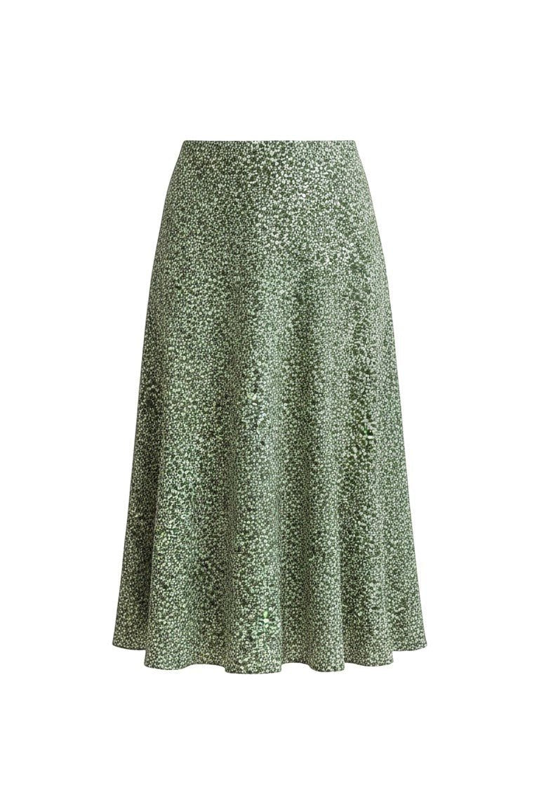 graced midi skirt in green with a delicate white floral print, featuring a flowing silhouette and polyester fabric.