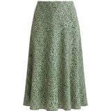 graced midi skirt in green with a delicate white floral print, featuring a flowing silhouette and polyester fabric.