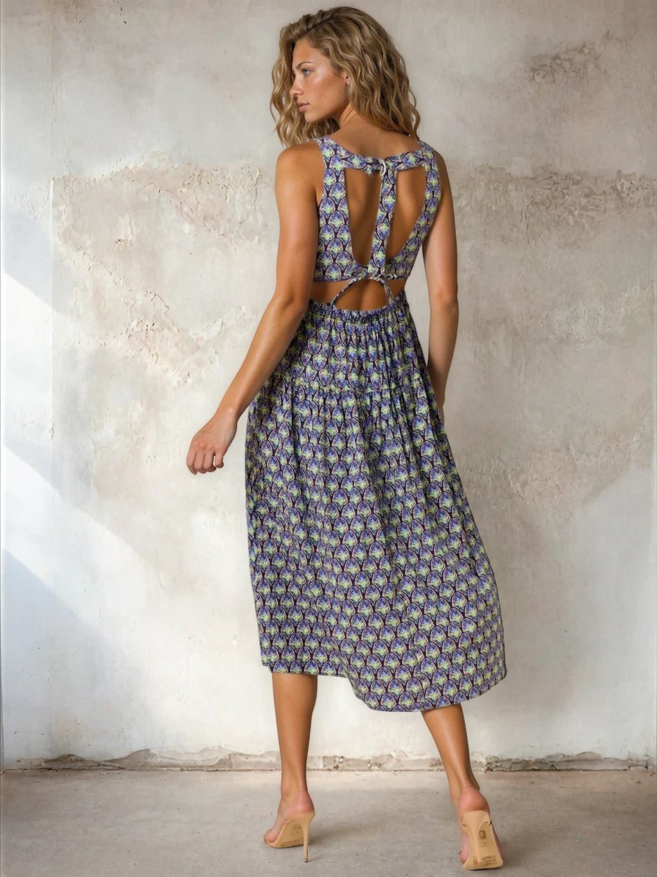 Floral print square neck midi dress by Doe and Rae, featuring a fitted bodice and flowy skirt in rayon and nylon fabric.