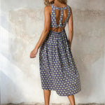 Floral print square neck midi dress by Doe and Rae, featuring a fitted bodice and flowy skirt in rayon and nylon fabric.