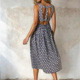 Floral print square neck midi dress by Doe and Rae, featuring a fitted bodice and flowy skirt in rayon and nylon fabric.