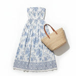 Floral smocked strapless midi dress by By Together, featuring a cotton-rayon fabric with a fitted bodice and flowing skirt.