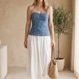 graced strapless blue denim bodice maxi dress with a flowing white cotton skirt. 97% cotton, 3% spandex.