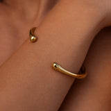 Silver form cuff bracelet by ALCO featuring a sleek, modern design with smooth curves and a polished finish.