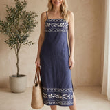 Navy embroidered straight neck midi dress by Forte, made of cotton with intricate embroidery, displayed on a hanger.