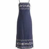 Navy embroidered cotton midi dress by Forte with a straight neckline and intricate embroidery, displayed on a mannequin.