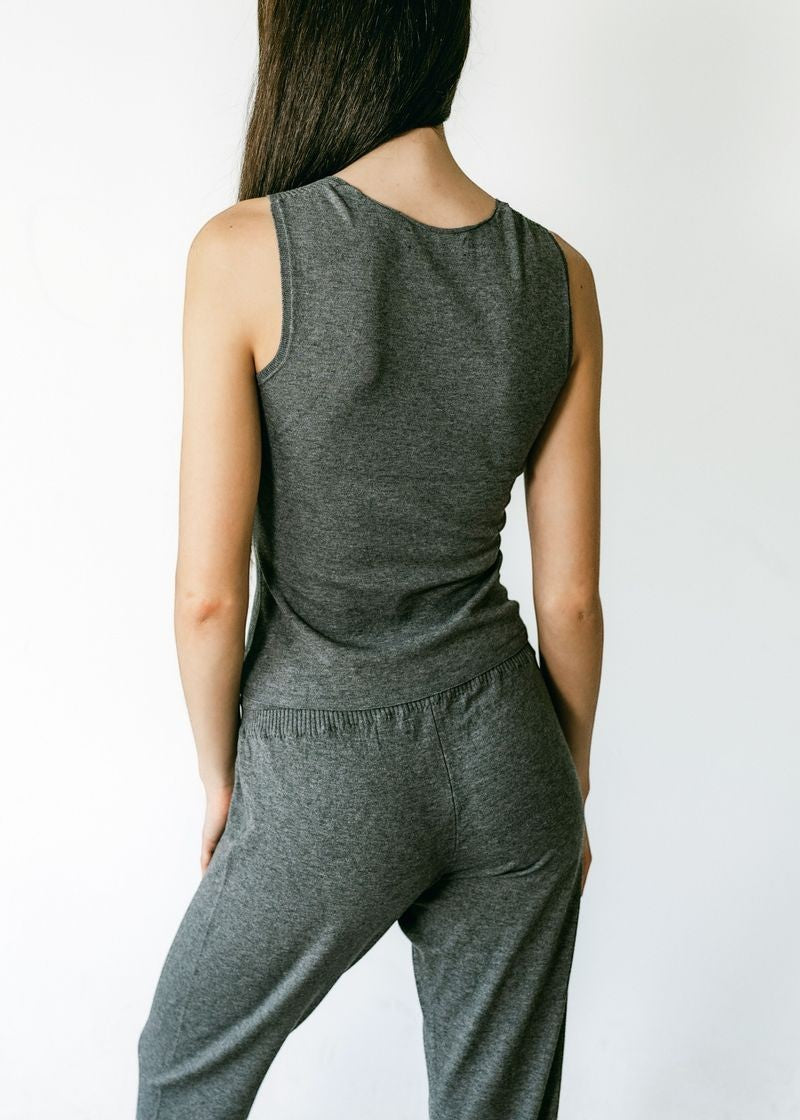 graced Agnes Knit Tank in charcoal grey EcoViscose blend with traveling rib trim detail. Model from back.