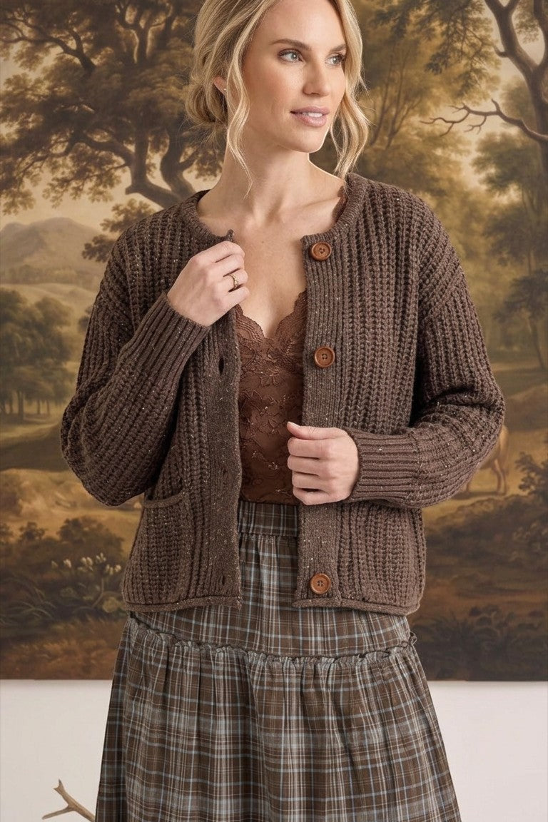 graced Amanda raw edge knit cardigan in dark brown with button front and ribbed texture worn by a woman