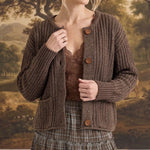 graced Amanda raw edge knit cardigan in dark brown with button front and ribbed texture worn by a woman