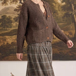 graced Amanda raw edge knit cardigan in brown worn by a woman with a plaid skirt