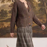 graced Amanda raw edge knit cardigan in brown worn by a woman with a plaid skirt