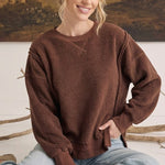 graced The Ashley oversized chocolate brown brushed fleece top with long sleeves worn by a smiling model
