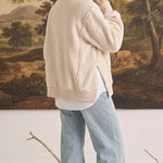 graced The Ashley oversized cream fleece top with side slits worn over a white shirt and light wash jeans