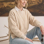 Model wearing graced The Ashley oversized cream fleece top with a white collared shirt underneath and blue jeans