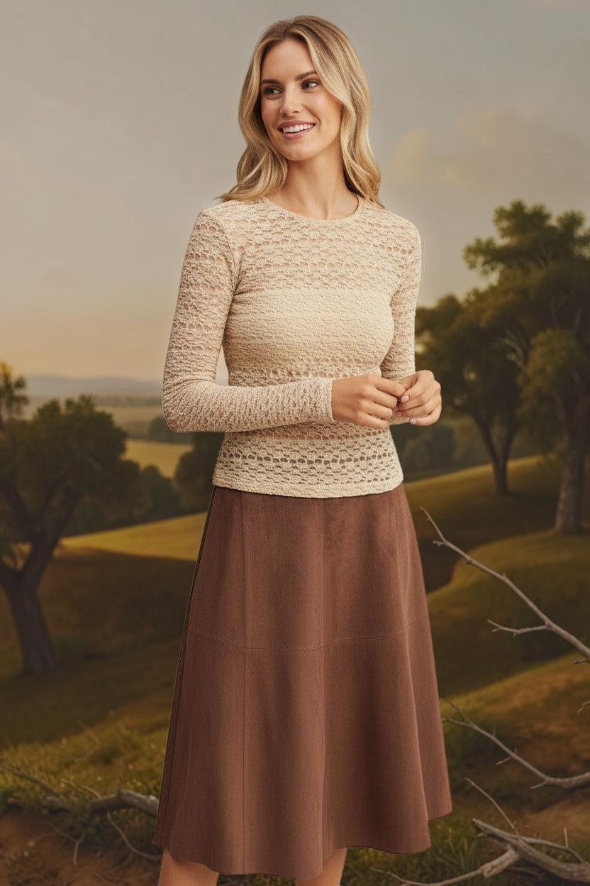 Beige floral lace knit top by Forte featuring intricate lace details and a soft, cozy knit fabric.
