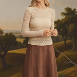 Beige floral lace knit top by Forte featuring intricate lace details and a soft, cozy knit fabric.