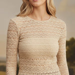 graced beige long-sleeve floral lace knit top worn by a smiling blonde model