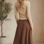 Beige floral lace knit top from Forte featuring intricate lace details and a soft, comfortable knit fabric.