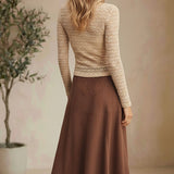 Beige floral lace knit top from Forte featuring intricate lace details and a soft, comfortable knit fabric.