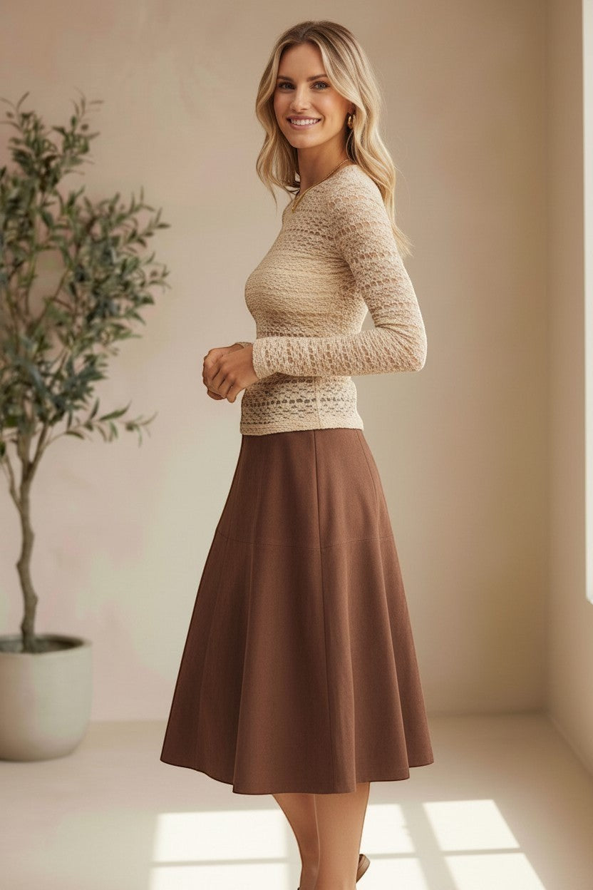 Beige floral lace knit top by Forte featuring intricate lace details and a soft, cozy knit fabric.
