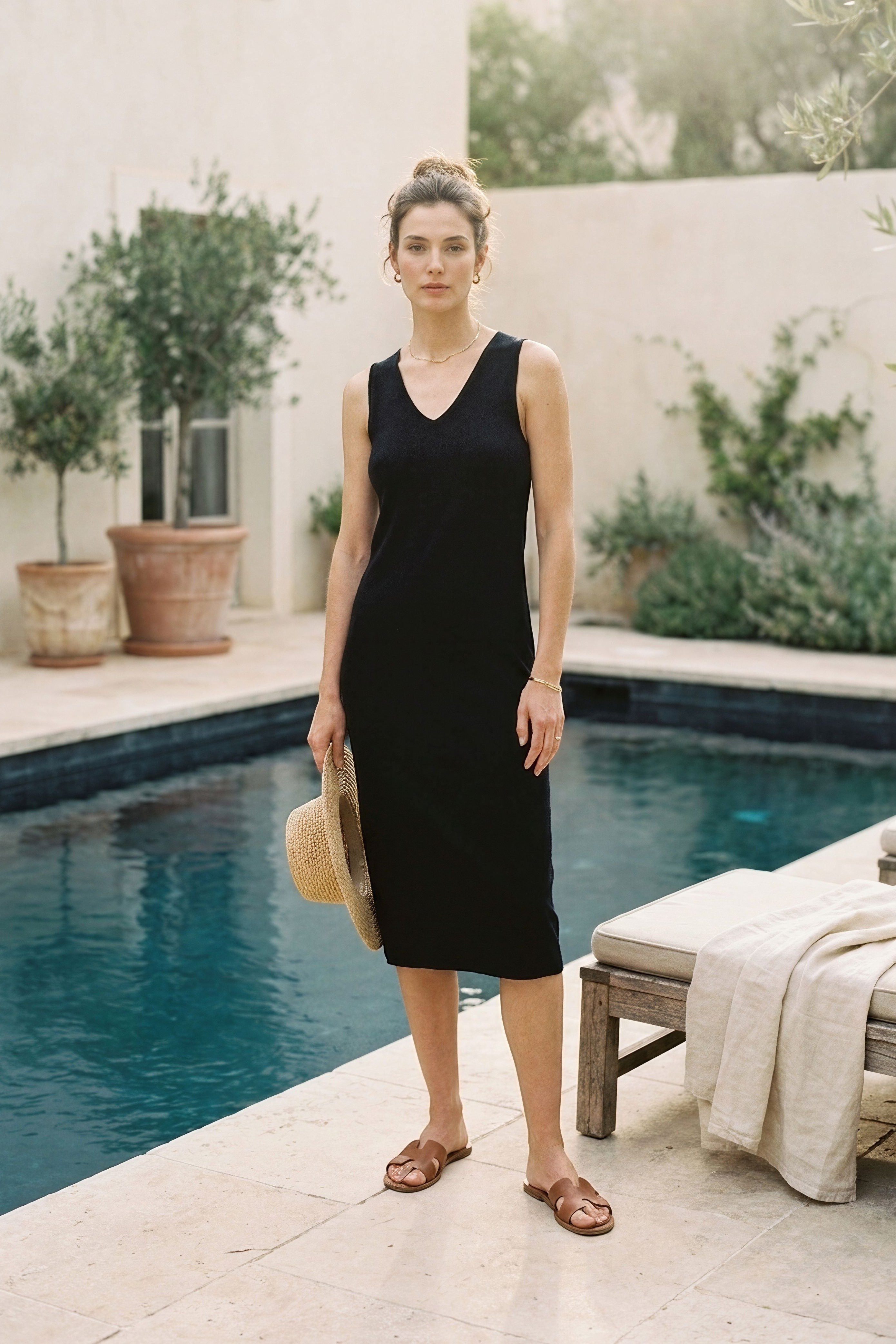 graced black 100% cotton sleeveless V-neck midi dress with 1x1 links hem detail