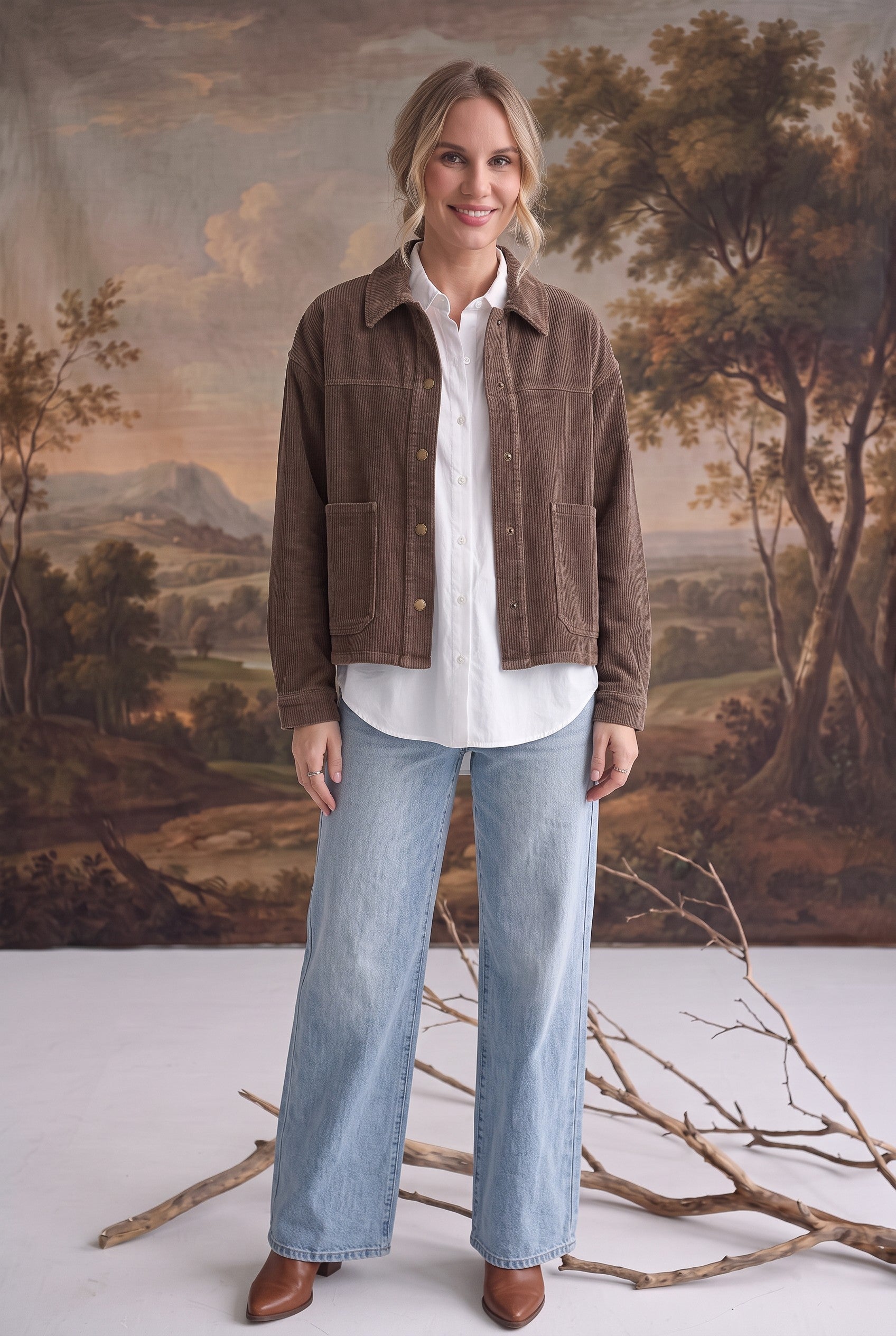 graced The Jess brown cotton corduroy jacket worn over a white shirt and light wash jeans