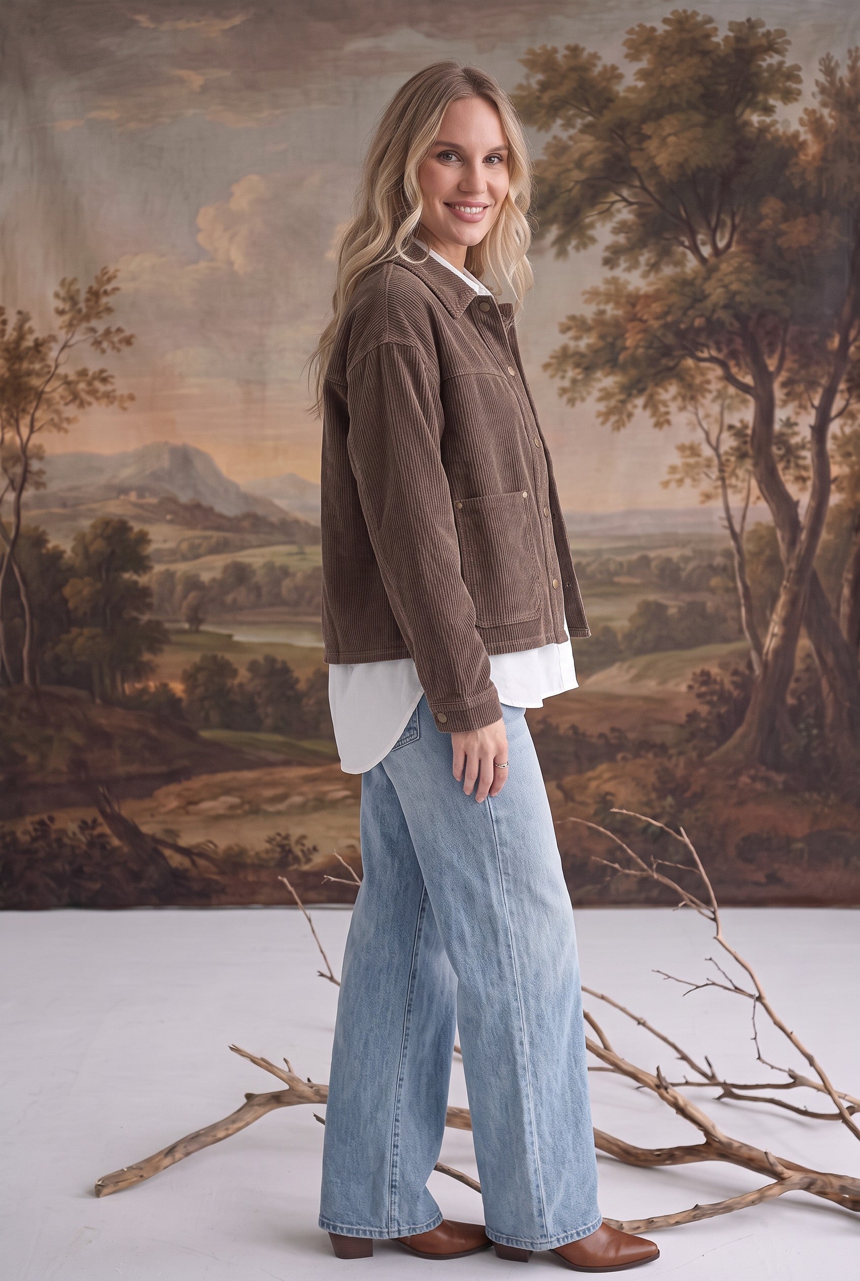 graced The Jess brown corduroy jacket worn by a blonde model with a white shirt and light wash wide-leg jeans