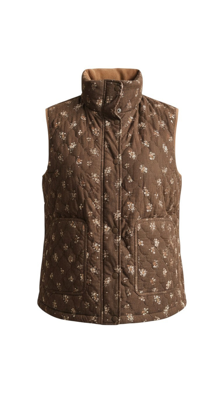 graced The Teagan Quilted Vest in brown with a delicate floral pattern, featuring a high collar and snap buttons.