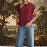 Burgundy crew neck sweater vest from in february, knit top with a classic fit and ribbed edges, displayed on a plain background.