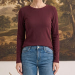 graced Basic Baby ribbed long sleeve top in deep burgundy worn by a woman with blue jeans
