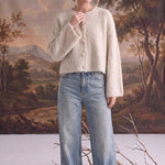graced Callie fuzzy knit cardigan in cream with a round neckline and drop shoulders worn with light wash jeans