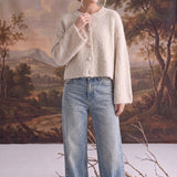 graced Callie fuzzy knit cardigan in cream with a round neckline and drop shoulders worn with light wash jeans