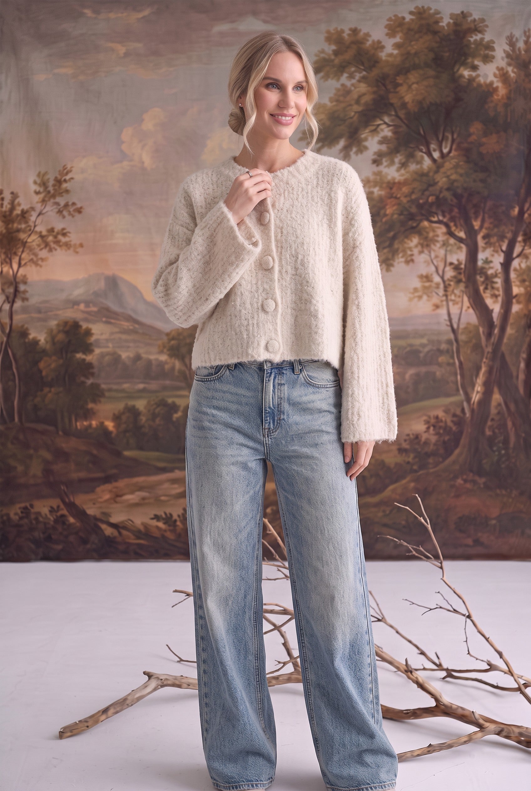 graced Callie fuzzy knit cardigan in cream with a round neckline and drop shoulders worn with light wash jeans