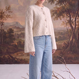 graced Callie fuzzy knit cardigan in cream with drop shoulders and button front, worn with light wash jeans